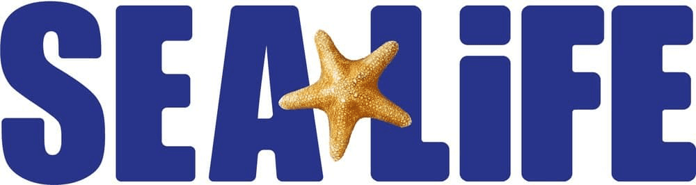 Centered within bold, capitalised navy blue text reading SEA LIFE. There is a shining gold star fish.