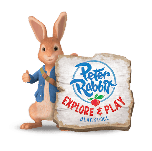 Cartoon Rabbit in a blue jacket holding their thumb up holds wood that reads Peter Rabbit: Explore and Play.