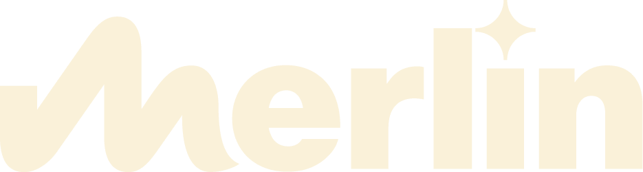 Merlin logo in Vanilla Ice Cream colour. There is a star over the I.